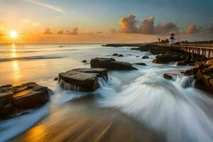 a lighthouse at sunset on the beach with waves crashing over rocks. AI-Generated photo