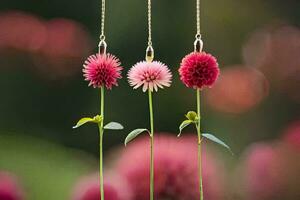 three pink flowers hanging from a string. AI-Generated photo
