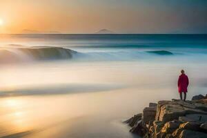 un persona en pie en el rocas a puesta de sol. generado por ai foto