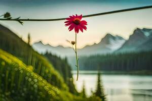 a flower hanging from a wire in front of a lake. AI-Generated photo