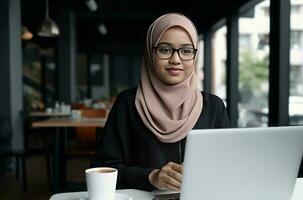 Pretty woman hijab working at computer. Generate Ai photo