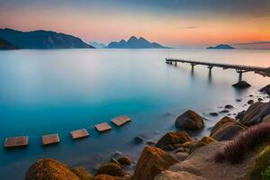 a pier in the ocean with rocks and mountains. AI-Generated photo