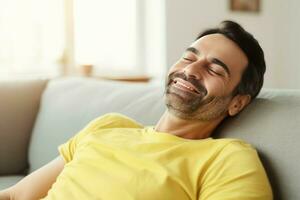 Happy man lying on beige sofa. Generate ai photo