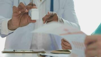 Group of doctors talking to pharmaceutical sales representative. video