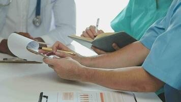 Group of doctors talking to pharmaceutical sales representative. video