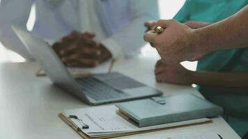 Group of doctors talking to pharmaceutical sales representative. video