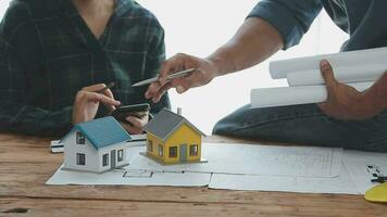 Architects, engineers and homeowners meeting at construction site video