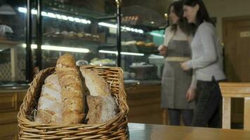 Selective focus on delicious bread in a basket at the bakery video