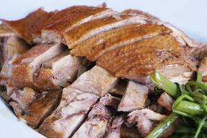 Roast Duck on white dish photo