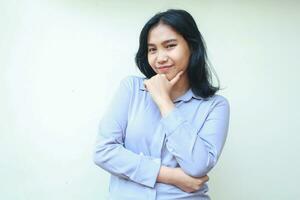 successful happy asian young business woman confident looking to camera with hand on chin and folded arm wear formal shirt isolated in white background photo