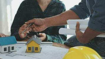 Architects, engineers and homeowners meeting at construction site video