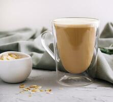 Almond milk latte in a glass photo