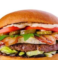 Bacon cheese burger with beef patty tomato cucumber photo