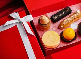 different french pastries in a christmas box photo