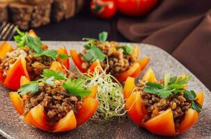 Tasty red stuffed tomatoes with rice and minced meat photo