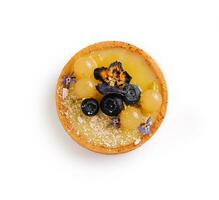 Lemon curd mini tarts on white plate photo