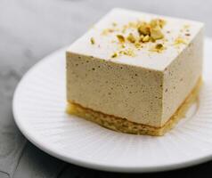 Souffle cake with nuts on plate photo