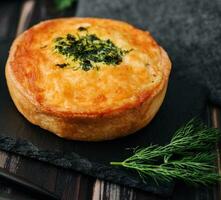 Closeup of mini quiche with dill photo