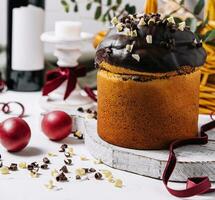 Easter cakes with colored eggs on a wooden table photo