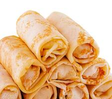 Stack of crepes rolls twisted with meat photo