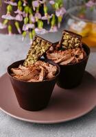 Chocolate cup cakes with tea pot photo