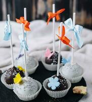 chocolate cupcakes on stone board with chocolate chips photo