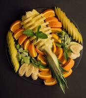 Fresh fruit platter on a plate photo