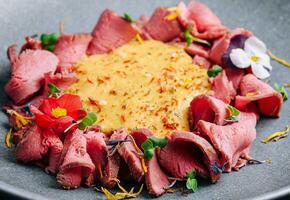 ham in cheese sauce on plate photo