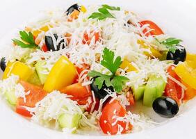 Fresh vegetable greek salad on white photo