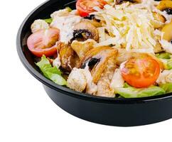 Warm salad with roasted chicken meat, vegetables and mushrooms photo