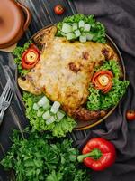Roast chicken with fresh vegetables top view photo