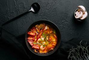 Tom Yum Goong - Thai hot and spicy soup photo