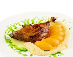 duck leg confit with mashed potatoes photo