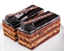 chocolate layered cakes slices on plate photo