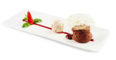 chocolate volcano with vanilla ice cream and strawberry photo