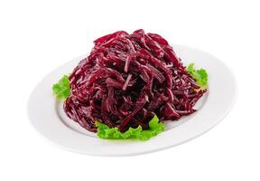 Fresh grated beetroot salad on plate photo