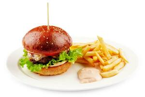 Classic beef burger with cheese and french fries photo