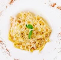 pasta tagliatelle with salmon and parmesan cheese photo
