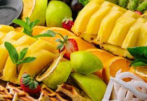 A plate of fruit assorted close up photo