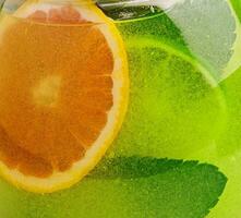 refreshing tea with lime and orange and mint photo