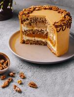 Fancy layered walnut cake with caramel photo
