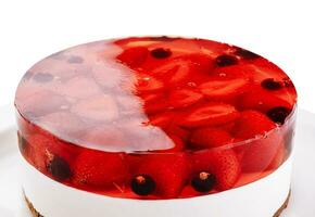 Fresh strawberry with currant jelly cake on plate photo