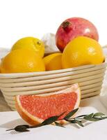 soda in a tin with oranges, grapefruits and pomegranate photo