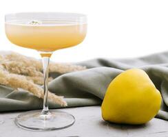 quince cocktail in a glass isolated photo