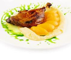 duck leg confit with mashed potatoes photo