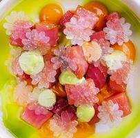 Tartar of tuna with lime snow on top view photo