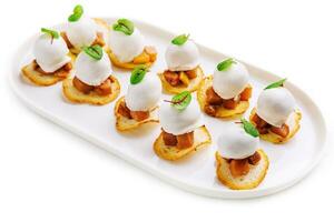 Italian style appetizer on white plate photo