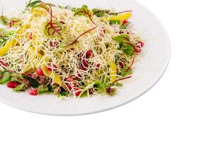 Fresh healthy salad with cheese and pomegranate photo