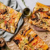 Long pizza mix lies with olive oil photo