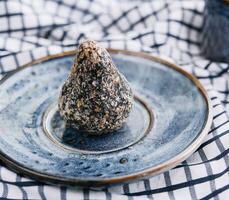 sweet handmade chocolate truffle on plate photo